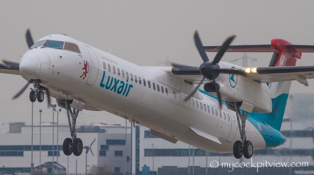 Mycockpitview. Luxair Bombardier Dash8 Q400 departing London City Airport on a grey morning.