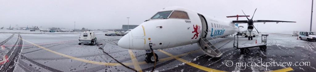 Luxair Bombardier Q400 ready for service on a winter day, Luxembourg. Mycockpitview
