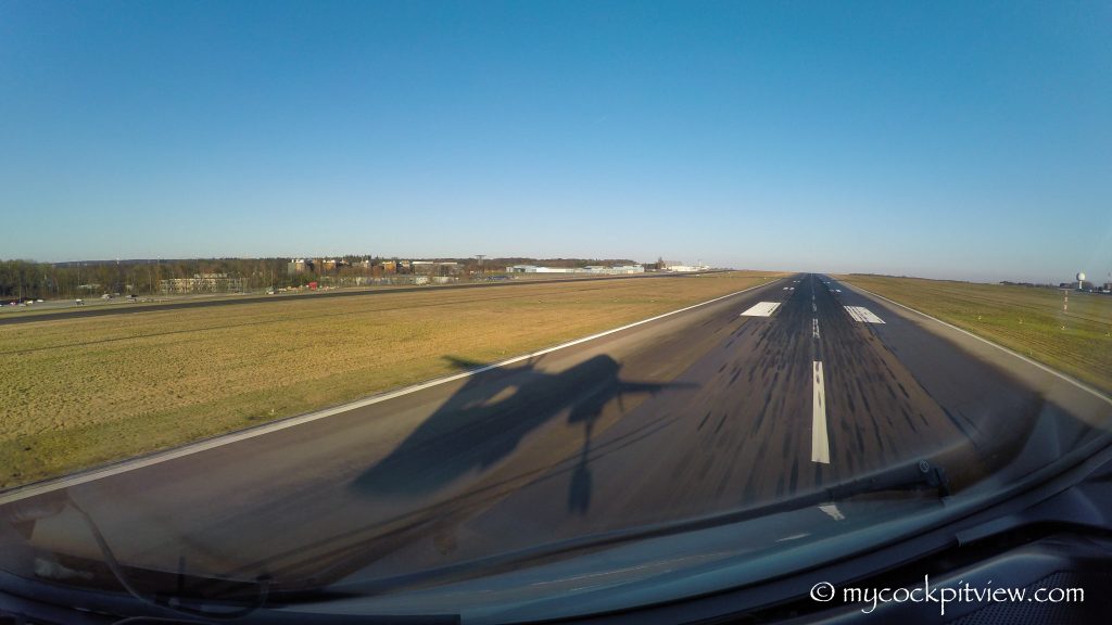 Catching our shadow while landing runway 06 in Luxembourg, mycockpitview, runway